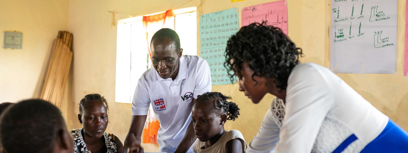 Volunteer teacher trainer and student